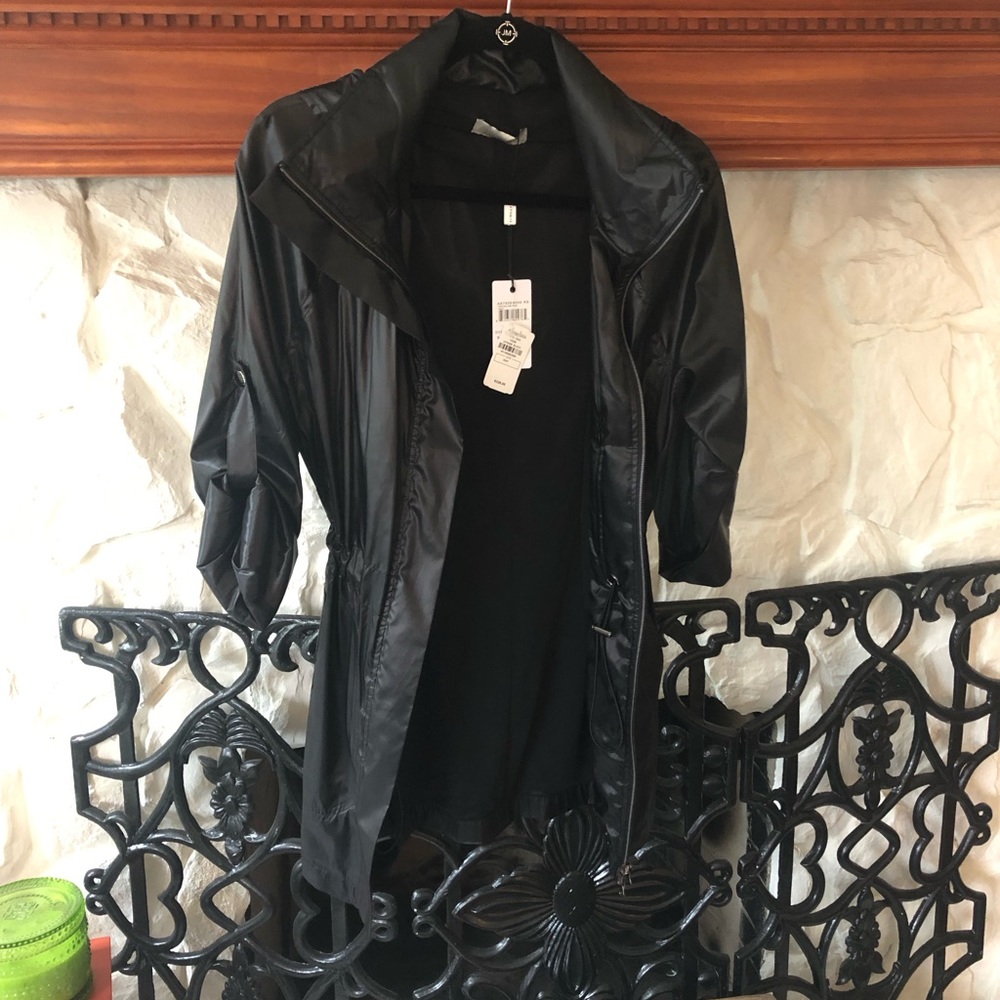 Black new metallic Merika travel windbreaker.